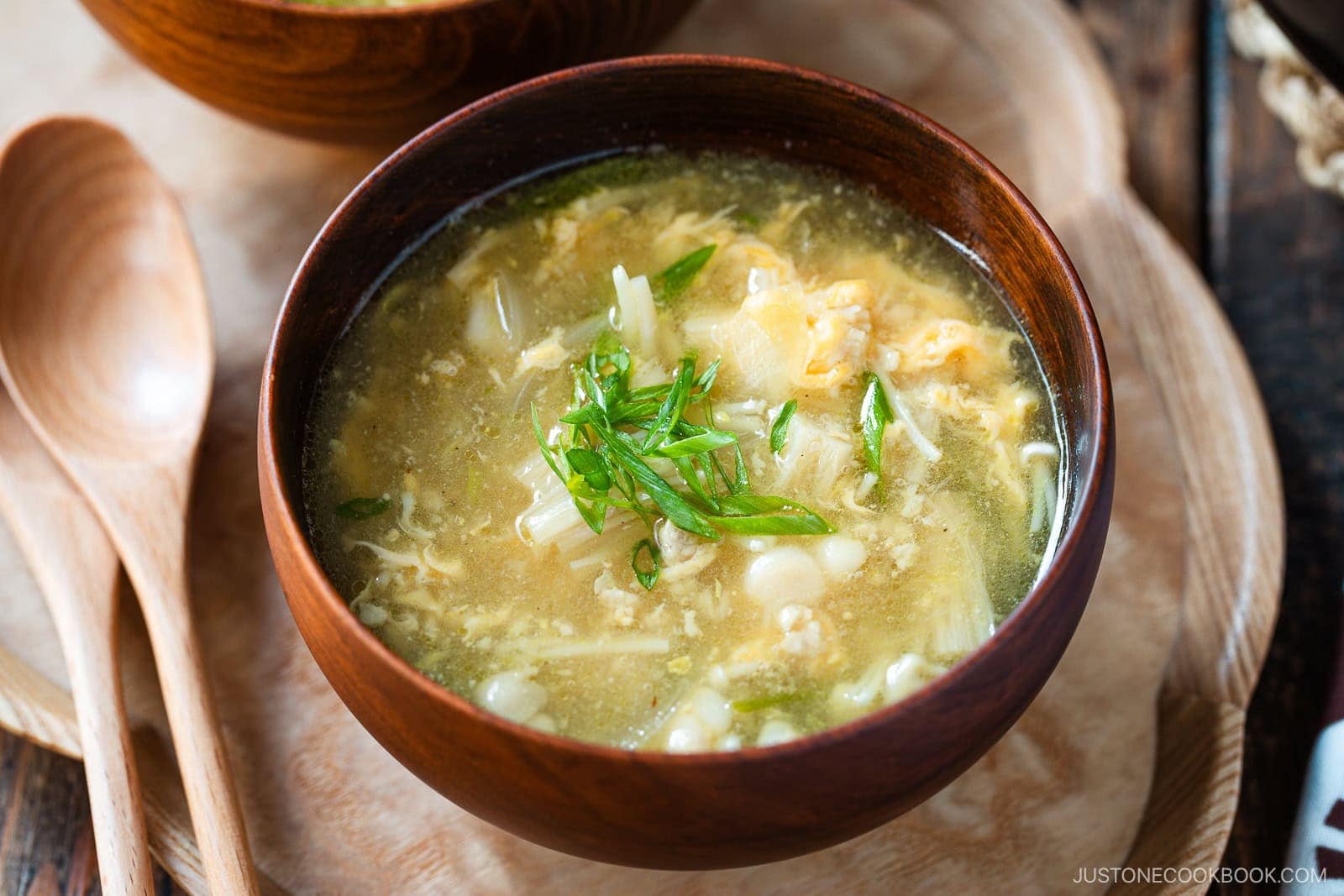 Japanese egg drop soup with enoki mushrooms and green onion.
