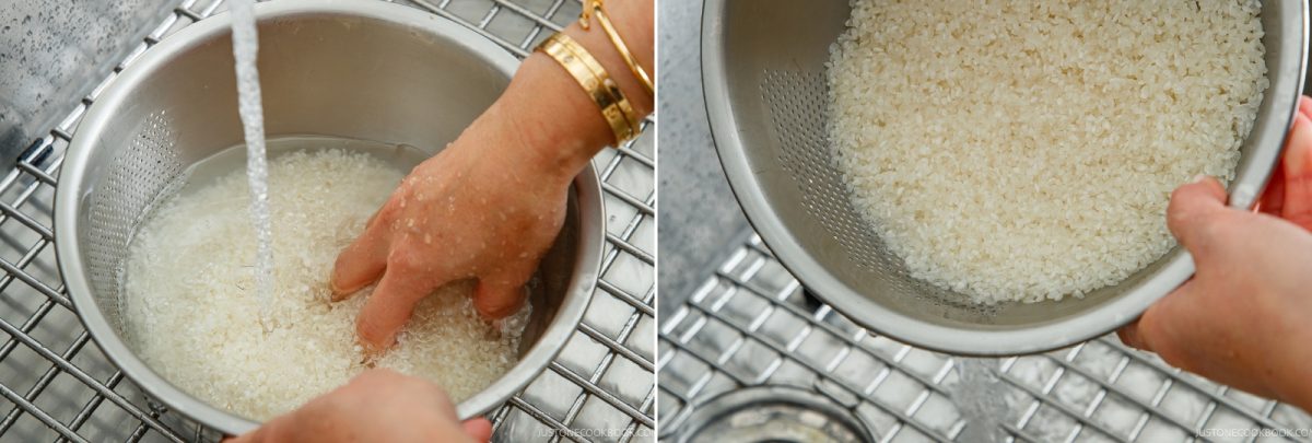 Hands rinsing white rice in a metal colander under a kitchen faucet to prepare it for how to cook rice in a donabe.