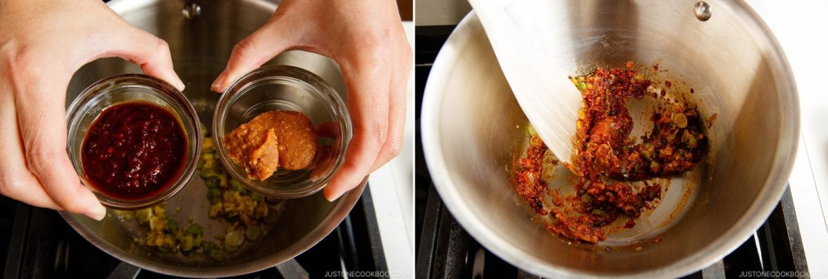 Hands hold two small glass bowls containing chili paste and miso paste above a stainless steel pan, which is shown on the right with the ingredients being stirred into aromatics.