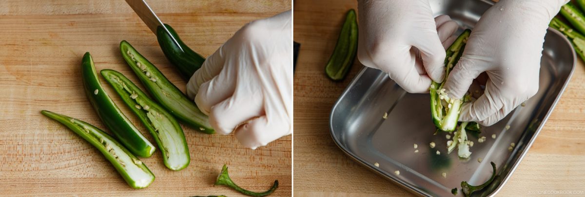 A person wearing gloves slices green chili peppers and removes their seeds on a wooden cutting board and a metal tray, carefully preparing the ingredients for an authentic Yuzu Kosho recipe.