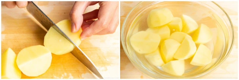 A hand slices a peeled potato on a cutting board; next to it, potato pieces&mdash;perfect for Japanese chicken curry&mdash;are soaking in a bowl of water.