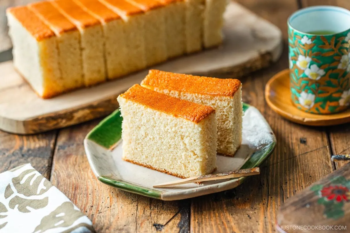 An octagon plate containing two slices of Castella cake.