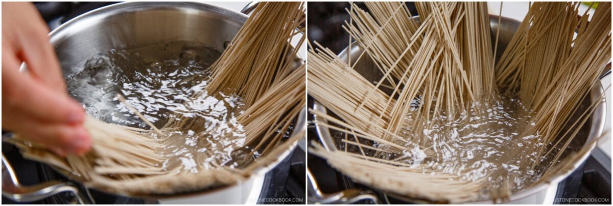 Two side-by-side images show uncooked noodles being added to a pot of boiling water on a stove—a key step in preparing Zaru Soba (Cold Soba). A hand holds the noodles in the left image, while the right shows them fanning out in the water.