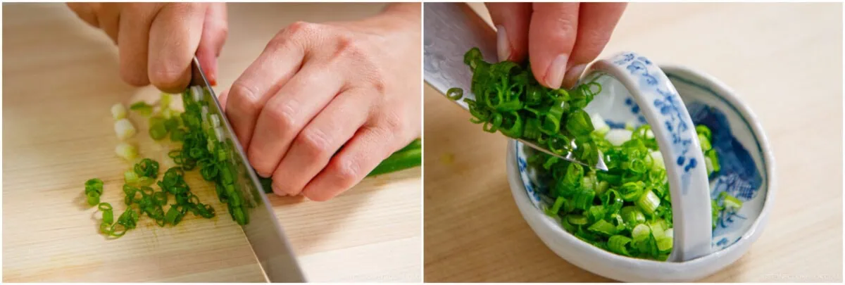 A person finely chops green onions on a wooden cutting board, then transfers the sliced green onions into a small, patterned bowl to prepare toppings for Zaru Soba (Cold Soba).