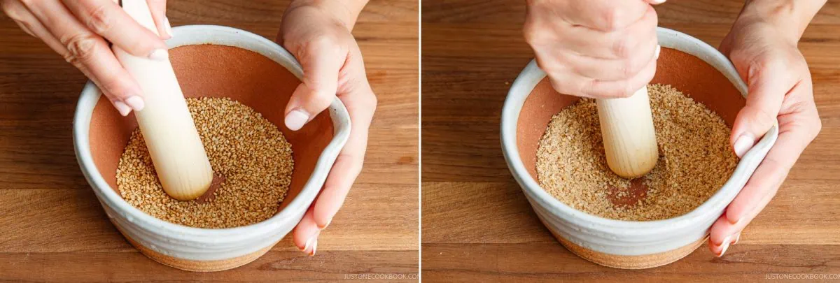 Two hands using a wooden pestle to grind toasted sesame seeds in a ceramic bowl on a wooden surface, shown from two different angles.